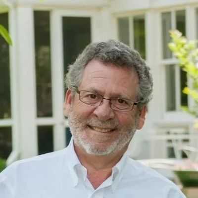 Dr. David Pickar, psychiatrist, author, and former NIMH researcher, smiling warmly in a professional headshot.