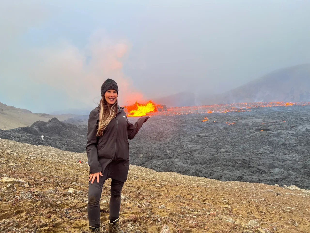 Geologist Dr. Tamie Jovanelly investigating volcanic rock formations in the field. Geologist Dr. Tamie Jovanelly investigating volcanic rock formations in the field.